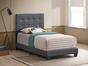 Upholstered Caldwell bed by Glory Furniture with a padded headboard and sleek design for a modern bedroom look.