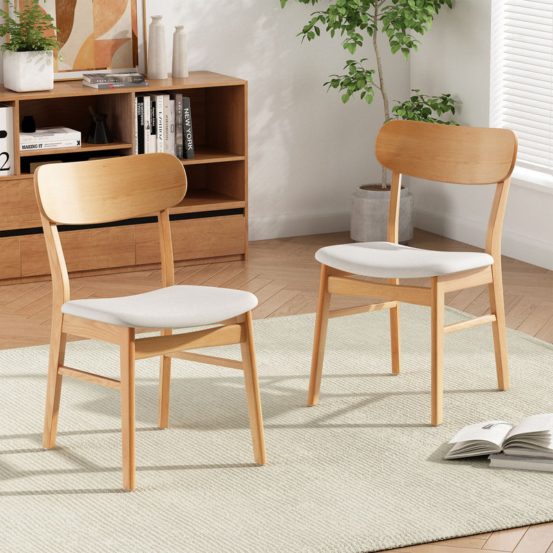 Set of two Noble House dining chairs with cushioned seats, featuring sleek wooden frames and comfortable upholstered seating.