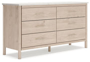 Signature Design by Ashley six-drawer dresser with sleek wood finish and modern handles, showcasing spacious storage and clean design.