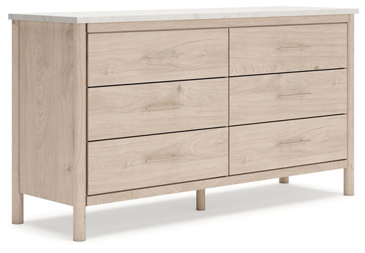 Signature Design by Ashley six-drawer dresser with sleek wood finish and modern handles, showcasing spacious storage and clean design.