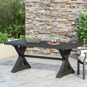 Modern Noble House outdoor dining table with X-shaped legs and umbrella hole, perfect for outdoor patio dining.