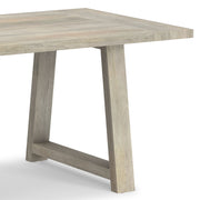 Simpli-Home Whitley dining table with wooden surface and sturdy legs, ideal for kitchen or dining room settings.