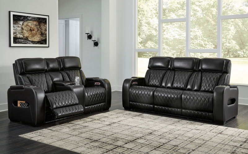 Black Boyington 2-piece power reclining sofa and loveseat set by Signature Design by Ashley, with plush cushions and reclining features.