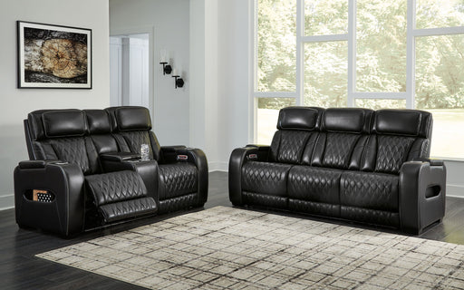 Black Boyington 2-piece power reclining sofa and loveseat set by Signature Design by Ashley, with plush cushions and reclining features.