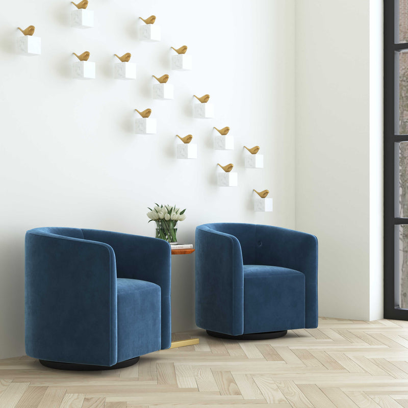 Blue Uttermost Mallorie swivel chair with a rounded back and cushioned seat, showcasing a modern, stylish design.