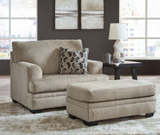 Signature Design by Ashley 3-piece living room set with sofa, loveseat, and armchair in a modern fabric, arranged in a cozy living space.