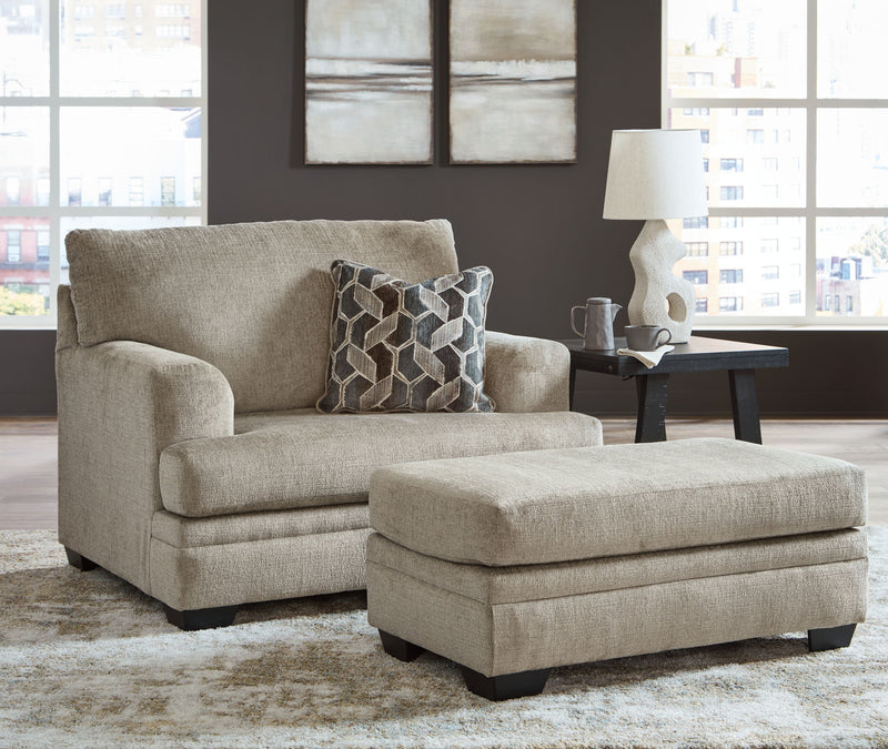 Signature Design by Ashley 3-piece living room set with sofa, loveseat, and armchair in a modern fabric, arranged in a cozy living space.