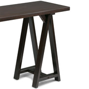 Handcrafted Simpli-Home console sofa table with sawhorse-style legs and wood finish, designed for living room or entryway decor.
