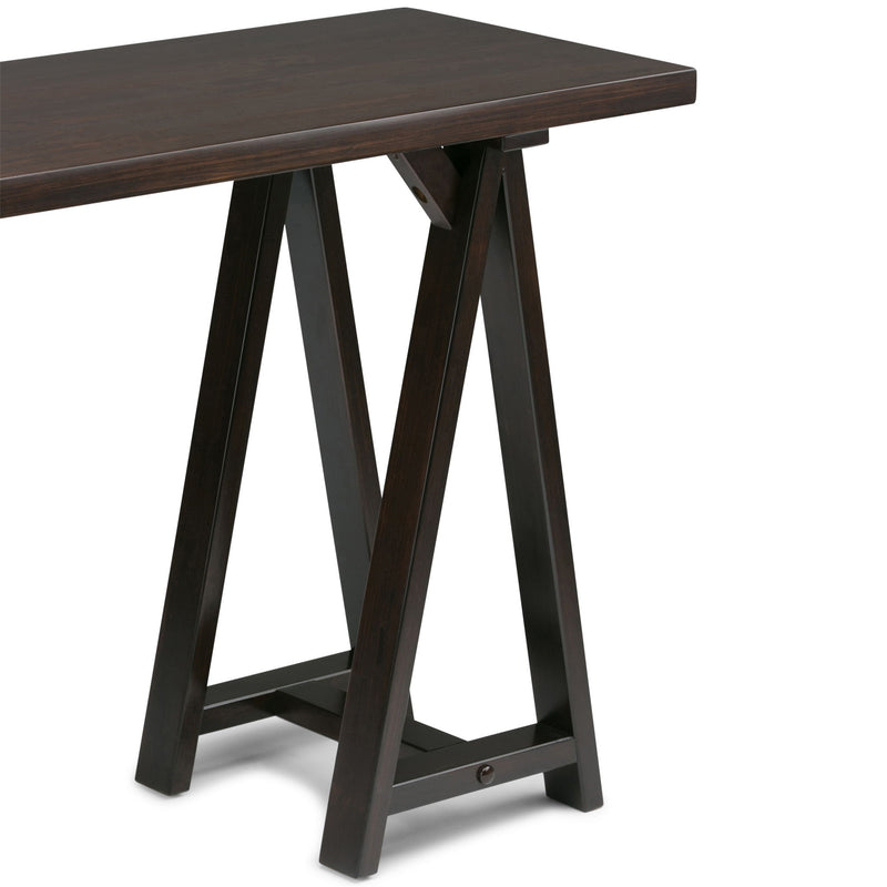 Handcrafted Simpli-Home console sofa table with sawhorse-style legs and wood finish, designed for living room or entryway decor.