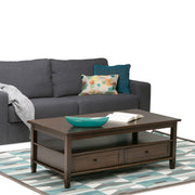 Handcrafted Warm Shaker coffee table by Simpli-Home featuring a wooden surface and sturdy legs in a warm finish.