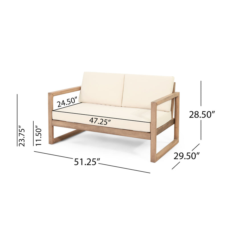 Noble House 4-piece acacia wood outdoor patio furniture set with coffee table, deep seating porch chairs and beige cushions.