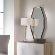Uttermost Savion gold octagon wall mirror with a sleek modern frame, hanging on a wall for stylish home decor.