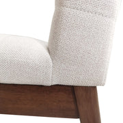 Set of two Noble House upholstered dining chairs with beige fabric and black rubber legs, modern and comfortable for dining rooms.