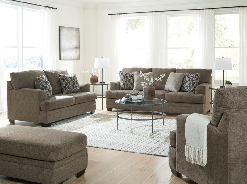 Signature Design by Ashley 3-piece living room set with sofa, loveseat, and armchair featuring neutral fabric and modern style.