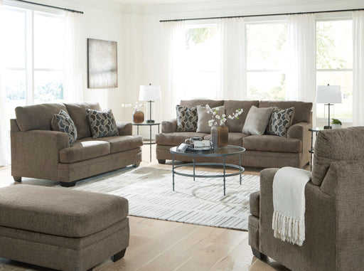 Signature Design by Ashley 3-piece living room set with sofa, loveseat, and armchair featuring neutral fabric and modern style.