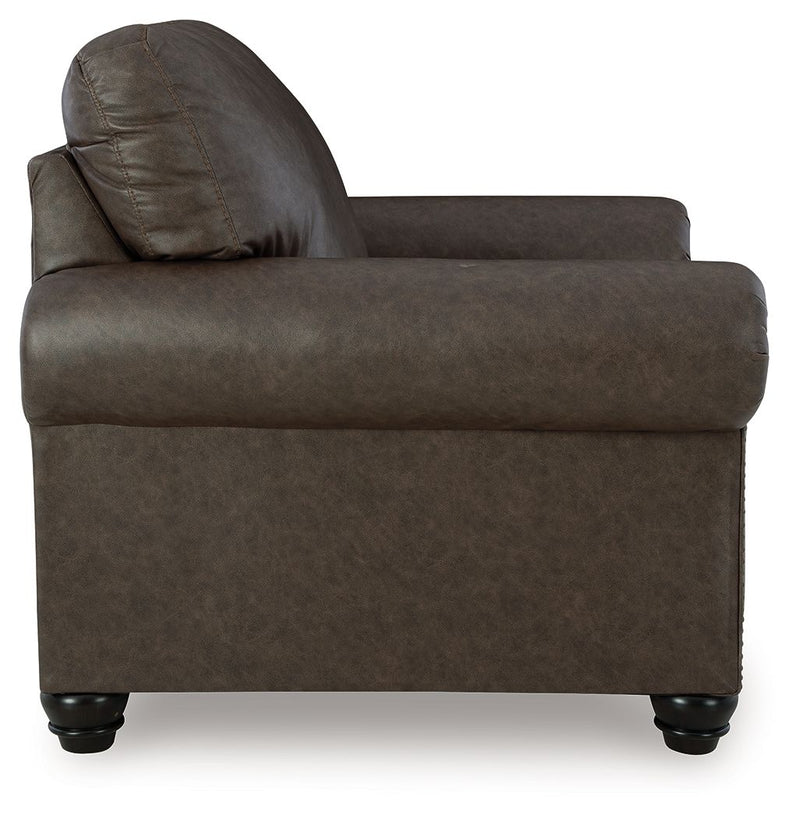 Benchcraft Roxmere living room set with stationary chair and ottoman, featuring plush upholstery and modern design.