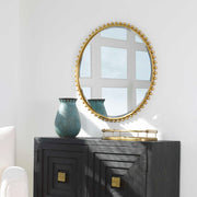 Round iron wall mirror by Uttermost featuring a sleek, modern design with a black finish and a sturdy frame.