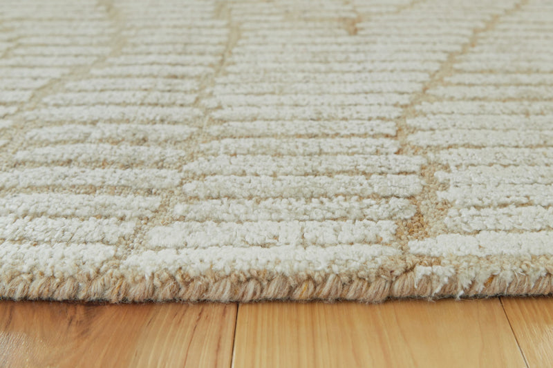 Signature Design by Ashley Jaseena area rug with intricate patterns and soft texture, perfect for living room or bedroom decor.