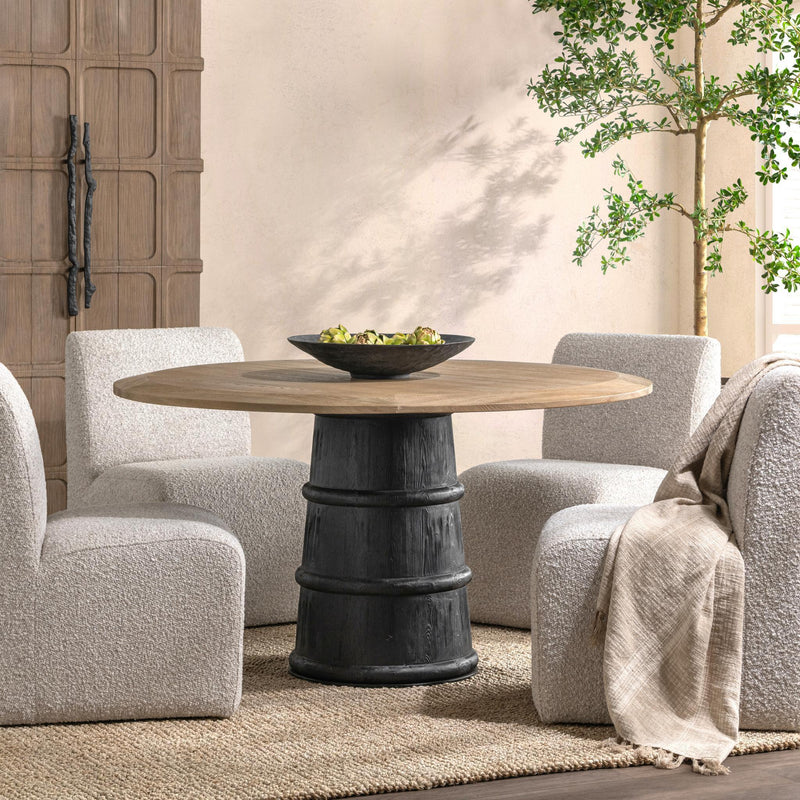 Lunen 55-inch round dining table by Classic Home with soft reef noir finish, featuring smooth tabletop and sturdy legs.