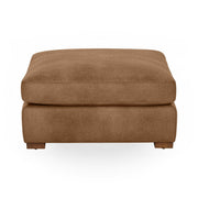 Classic Home Audrey upholstered ottoman with plush fabric and wooden legs, perfect as a versatile living room accent piece.