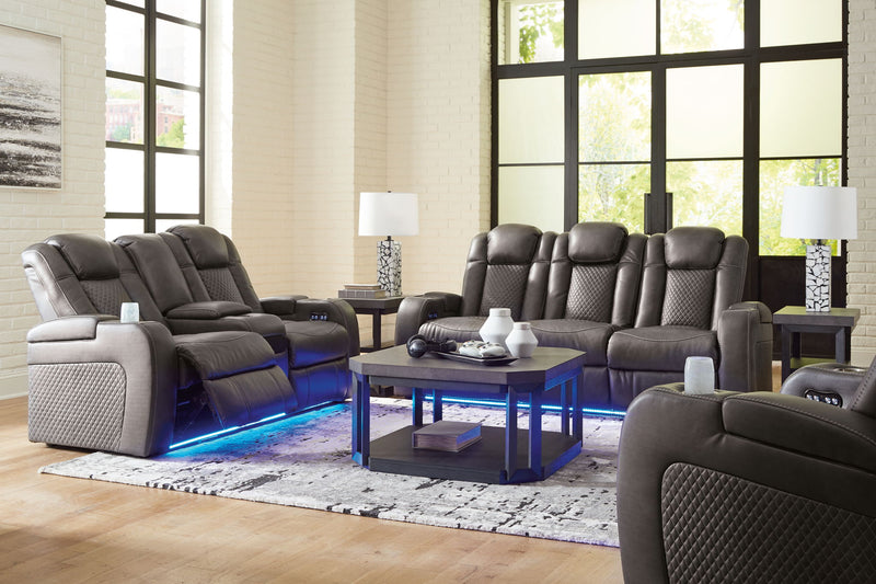 Signature Design by Ashley Fyne-dyme reclining sofa set with plush cushions and reclining features in a modern living room setting.