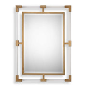 Uttermost Balkan iron wall mirror with round, distressed metal frame, hanging on a neutral-colored wall.