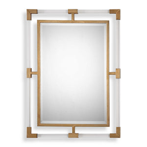 Uttermost Balkan iron wall mirror with round, distressed metal frame, hanging on a neutral-colored wall.