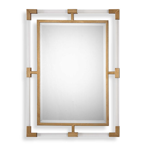 Uttermost Balkan iron wall mirror with round, distressed metal frame, hanging on a neutral-colored wall.