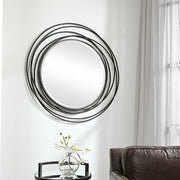 Uttermost Whirlwind round wall mirror with a sleek frame, perfect for modern interior decor.