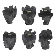 Set of six Uttermost self-portrait mask wall decor pieces featuring artistic, textured face designs for modern interior decoration.