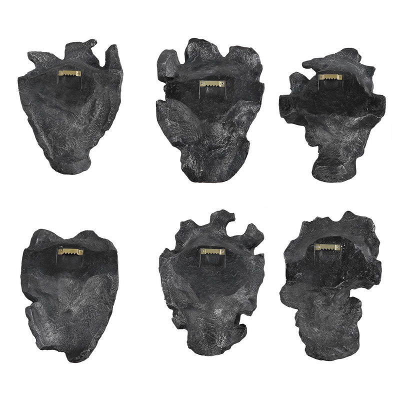 Set of six Uttermost self-portrait mask wall decor pieces featuring artistic, textured face designs for modern interior decoration.