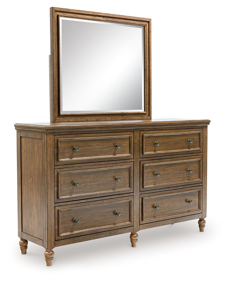 Benchcraft Sturlayne 6-piece panel bedroom set with bed, dresser, mirror, nightstands, and storage options, in a modern bedroom design.