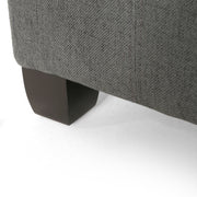 Noble House Isabella contemporary storage ottoman with cushioned top and wooden legs, ideal for living room decor.