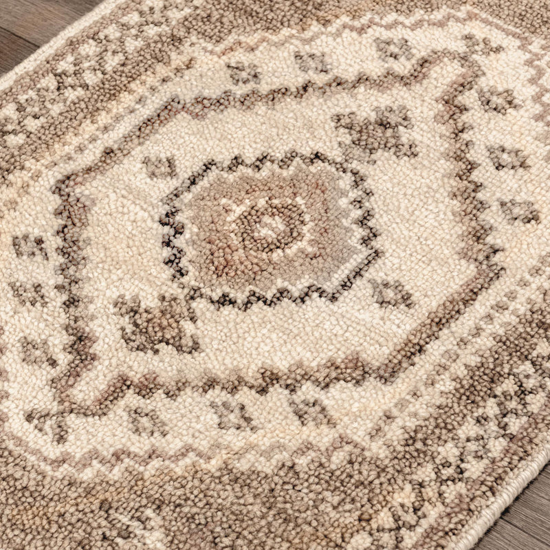 Classic Home Luxor hand-knotted area rug with intricate patterns and rich colors, showcasing detailed craftsmanship.