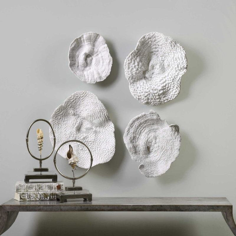 Uttermost Sea Coral wall art set of 4 in white, natural ocean-inspired wall decor with detailed coral designs.