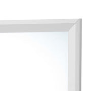 Glory Furniture Primo mirror with a sleek rectangular frame, hanging on a wall in a modern interior setting.
