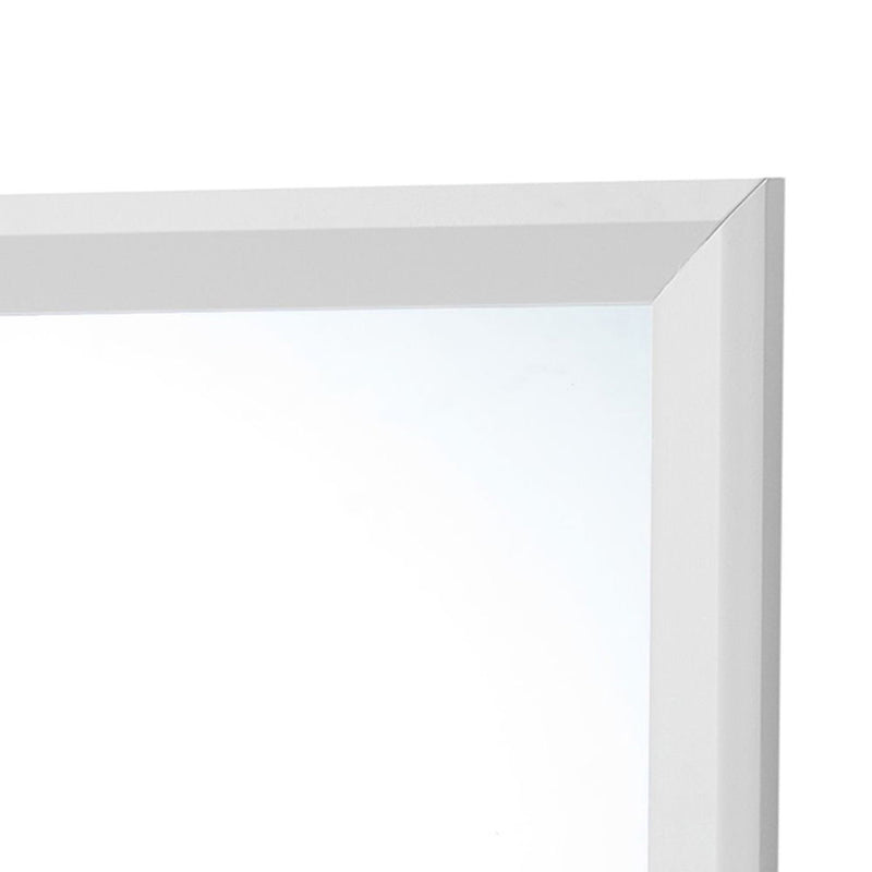 Glory Furniture Primo mirror with a sleek rectangular frame, hanging on a wall in a modern interior setting.