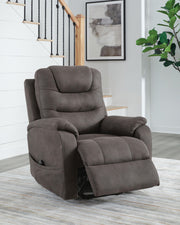 Signature Design by Ashley Snowfield Power Lift Recliner in gunmetal with padded armrests and plush cushioning.