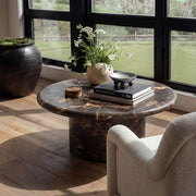 Dark brown Byron round coffee table by TOV Furniture with a smooth surface and modern design.