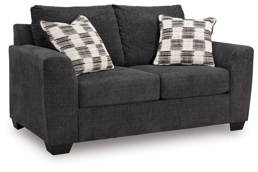 Benchcraft® Loreo stationary loveseat with plush cushions and modern design, perfect for cozy living room seating.