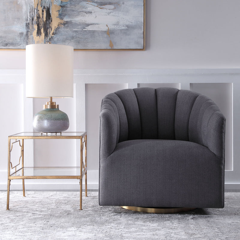 Dark gray modern swivel chair by Uttermost featuring a sleek design and cushioned seat for comfortable seating.