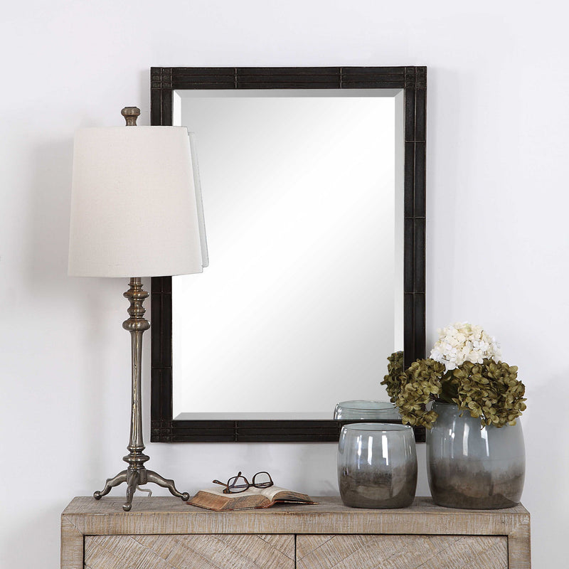 Aged black Gower vanity mirror by Uttermost with a sleek, rectangular frame and modern design for elegant bathroom or bedroom decor.