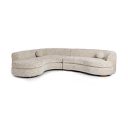 Classic Home Concord stationary sectional sofa with plush cushions and fabric upholstery, shown in a spacious living room setting.