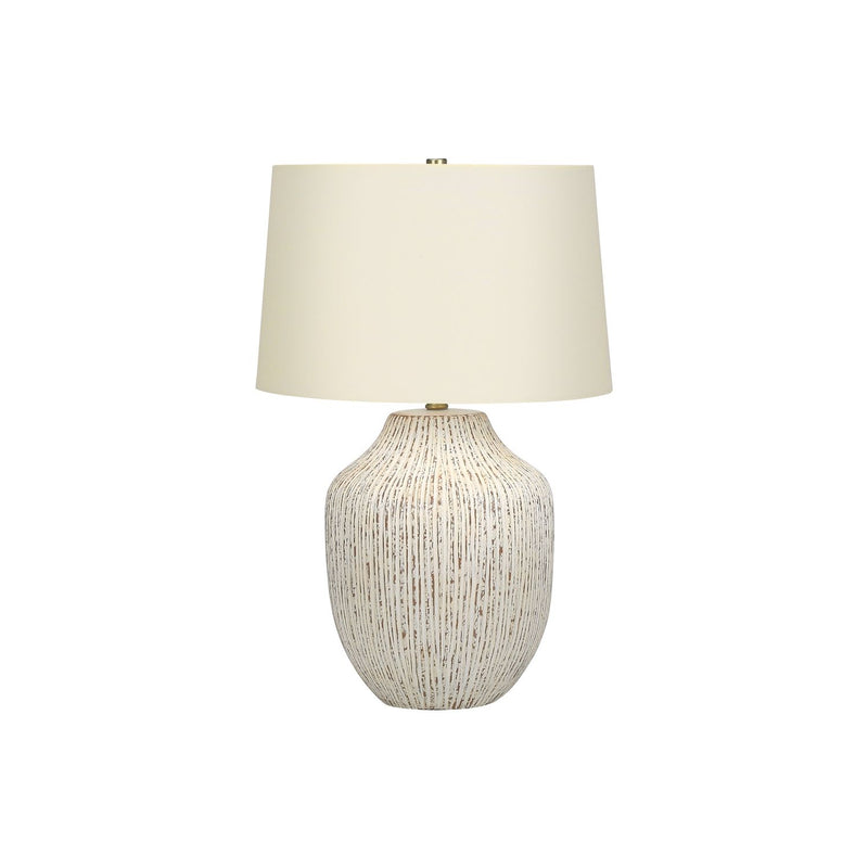 Cream ceramic transitional table lamp with a sleek design, featuring a rounded base and a fabric shade for elegant lighting.