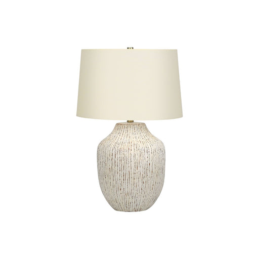 Cream ceramic transitional table lamp with a sleek design, featuring a rounded base and a fabric shade for elegant lighting.