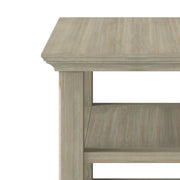 Handcrafted Acadian narrow side table by Simpli-Home, featuring a wooden surface and tapered legs in a natural finish.