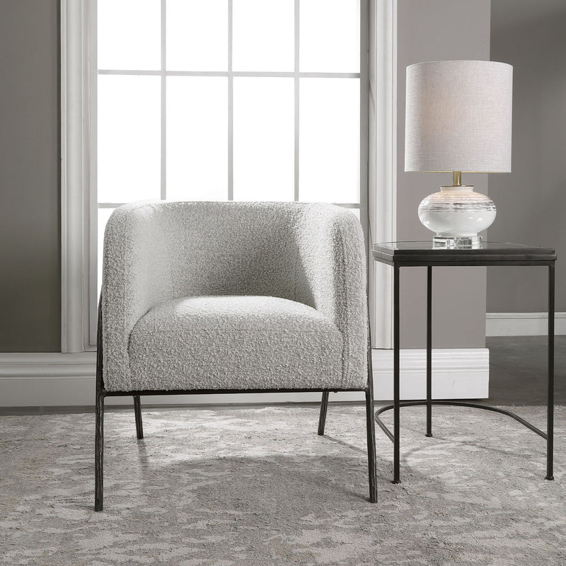 Uttermost Jacobsen accent chair with plush fabric upholstery and sleek wooden legs, stylishly designed for modern living rooms.