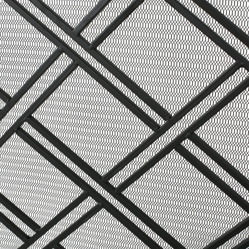 Noble House fireplace screen with elegant design, protective barrier featuring intricate metal scrollwork for safeguarding around a fire.