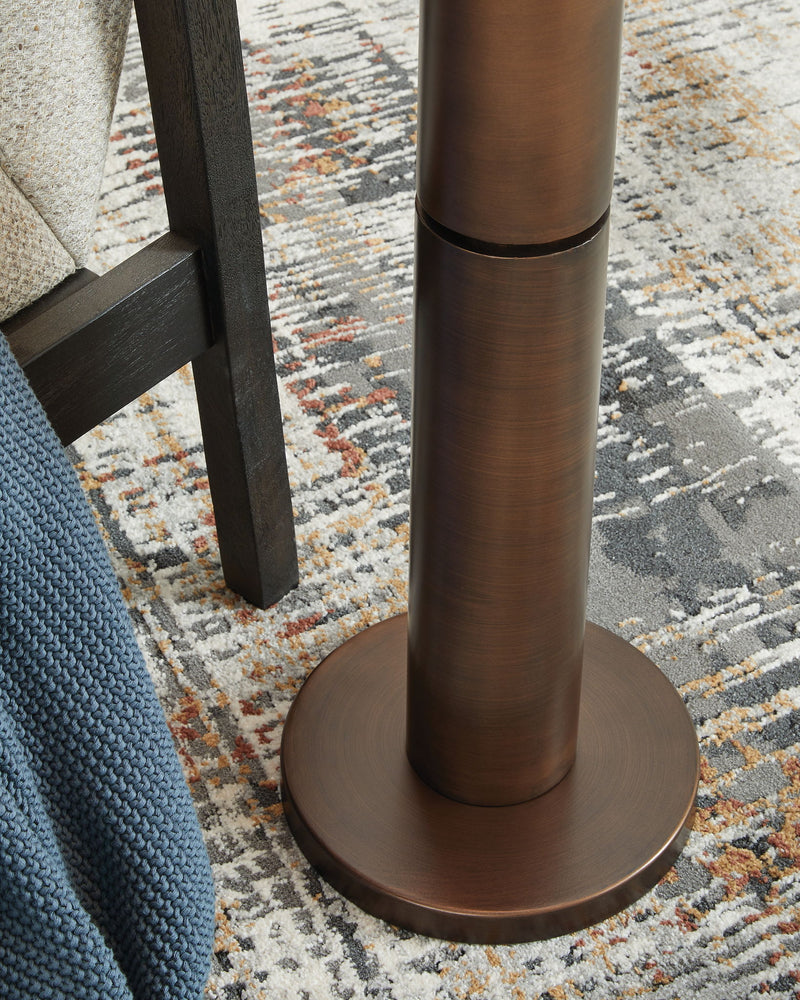 Metal floor lamp from Signature Design by Ashley® with a sleek, modern design and a sturdy base for living room lighting.