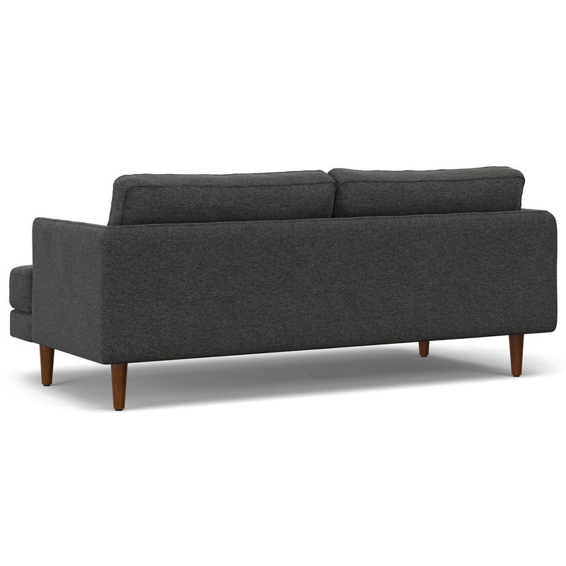 Livingston upholstered stationary sofa by Simpli-Home with plush fabric and cushioned armrests in a modern living room setting.